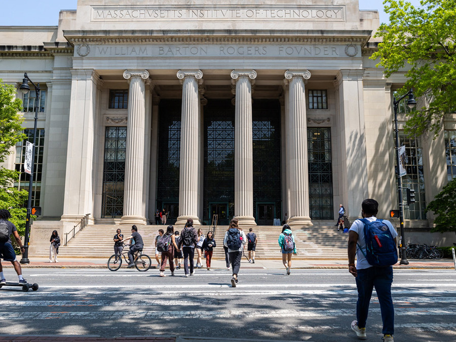 Outside of 77 Massachusetts Avenue, people walking up and down the steps